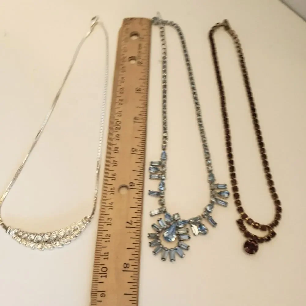 Bundle of choker necklaces two jeweled necklaces one red one pink one serpentine